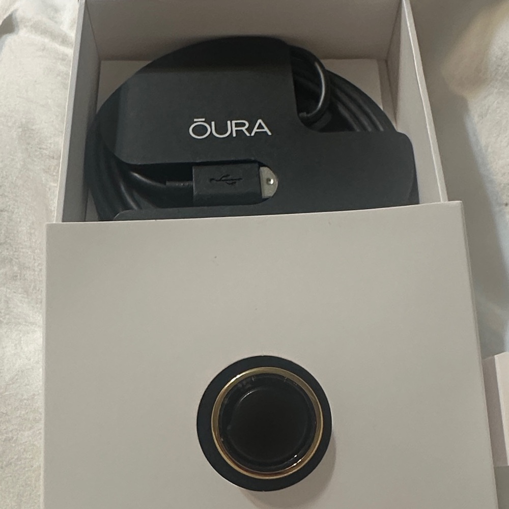 Oura Ring in Black with Gold Trim